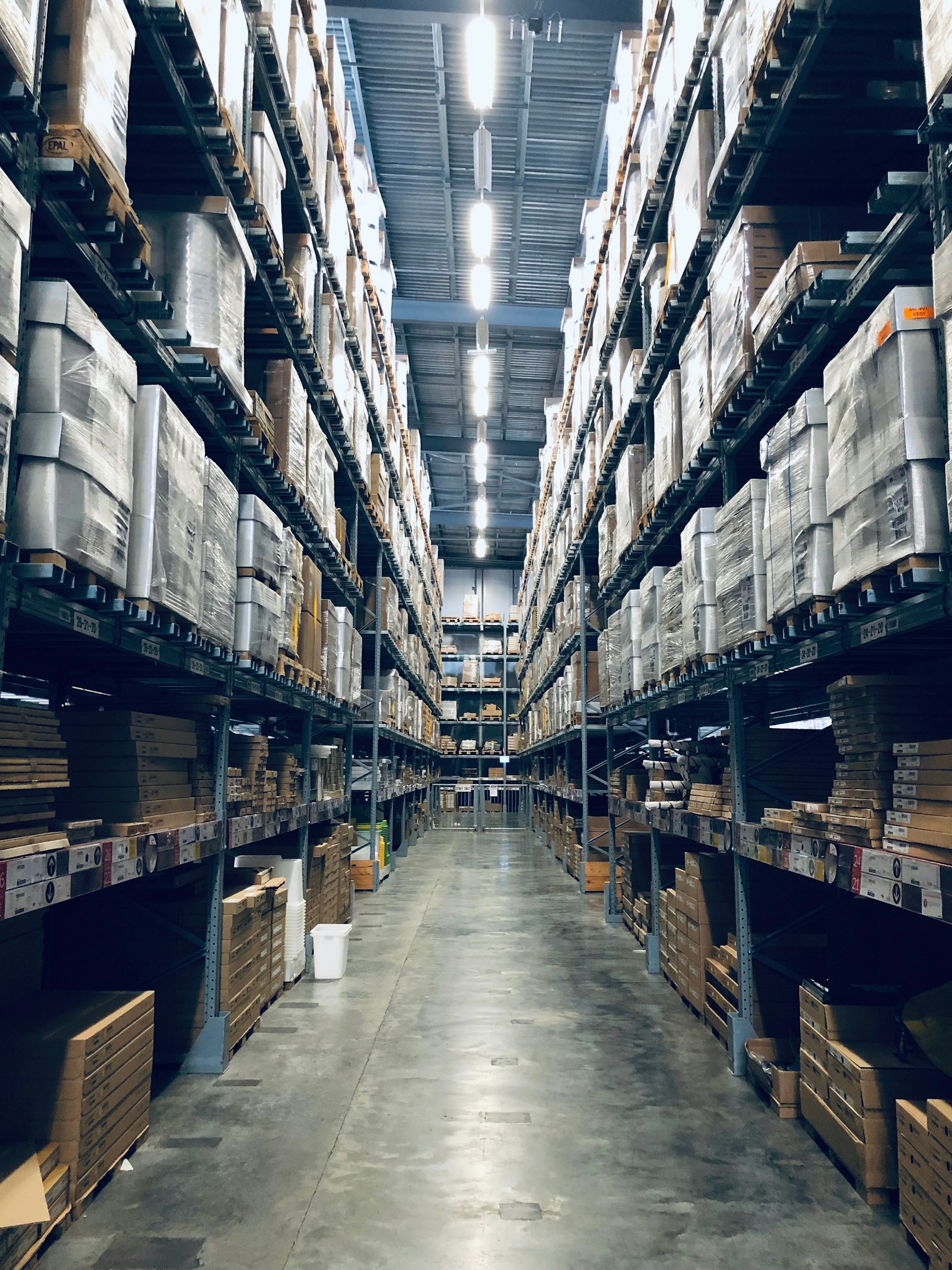 Organised warehouse interior with high storage racks